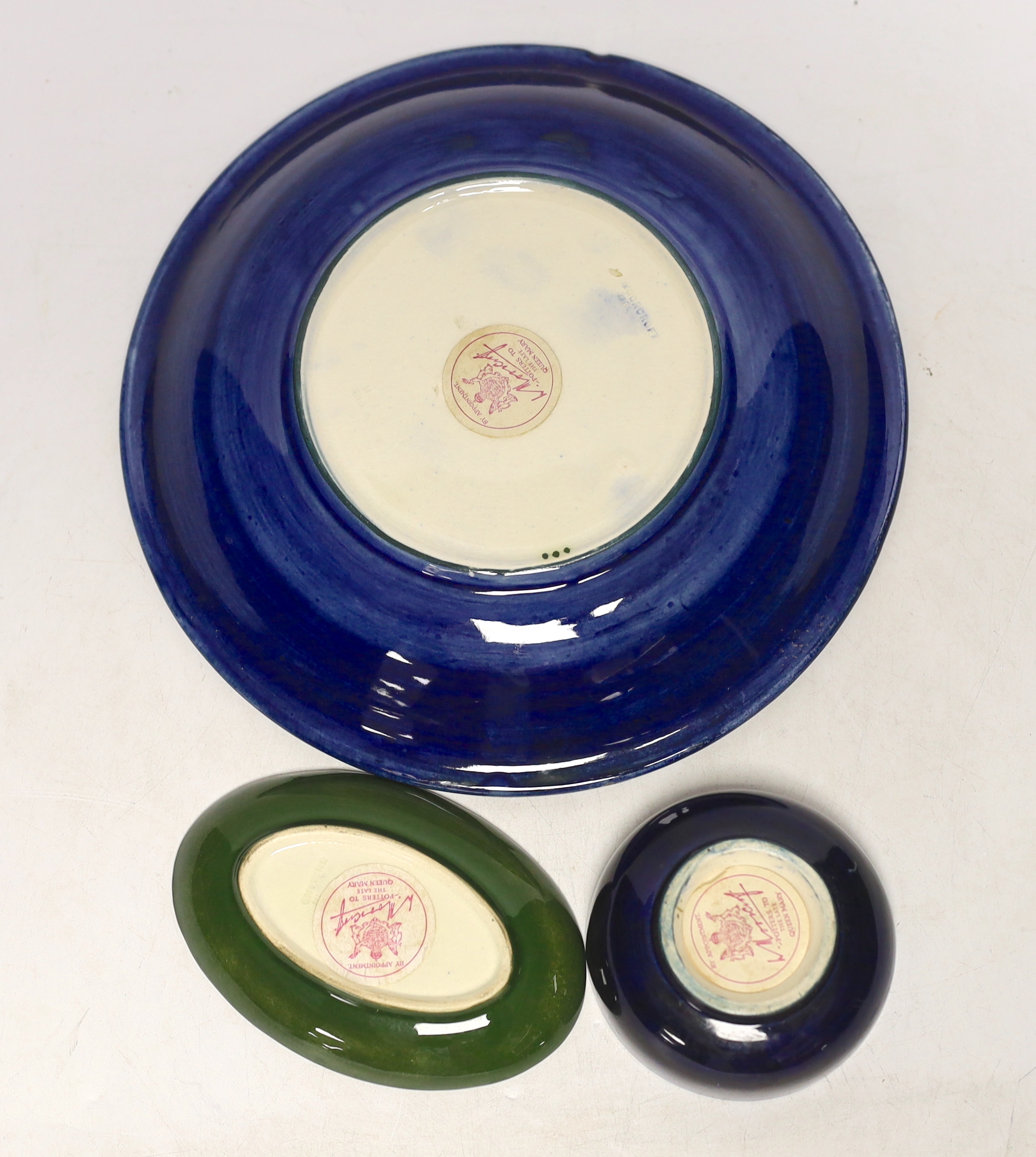 A Moorcroft Pansy plate, pin dish and a small bowl, 22cm in diameter